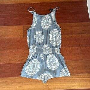Blue and white romper with a tie dye pattern